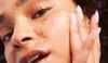Model Applying Face Moisturizer