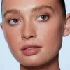 model wearing e.l.f. luminous putty bronzer