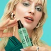 Model Holding e.l.f. Power Grip Dewy Setting Spray 