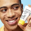 Model Holding Invisible Sunscreen 35